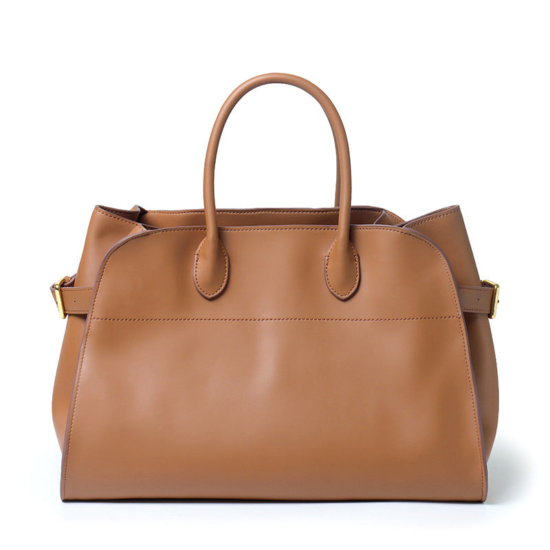 "Sac à main NOXA design minimaliste en cuir, vue avant, couleur noire; chic et structuré pour un style urbain et élégant."
