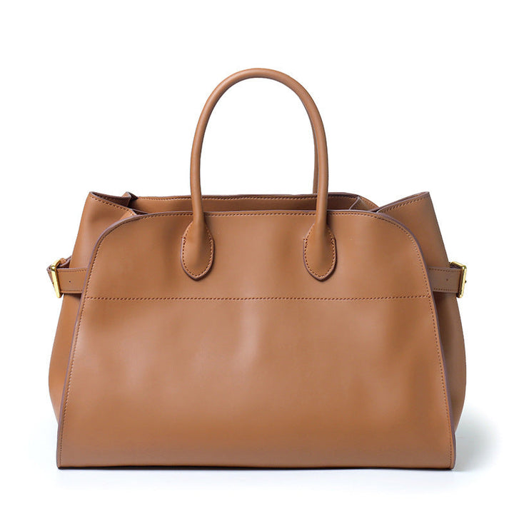 "Sac à main NOXA design minimaliste en cuir, vue avant, couleur noire; chic et structuré pour un style urbain et élégant."