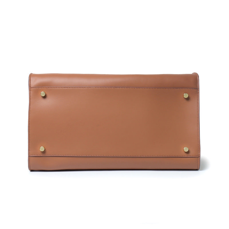 "Sac à main NOXA design minimaliste en cuir, vue avant, couleur noire; chic et structuré pour un style urbain et élégant."