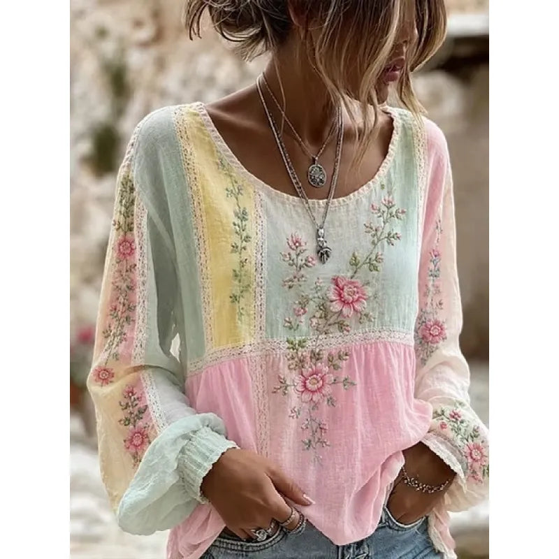 Blouse femme brodée de fleurs, coupe ample et manches longues. Style bohème chic pour le printemps et l'été.
