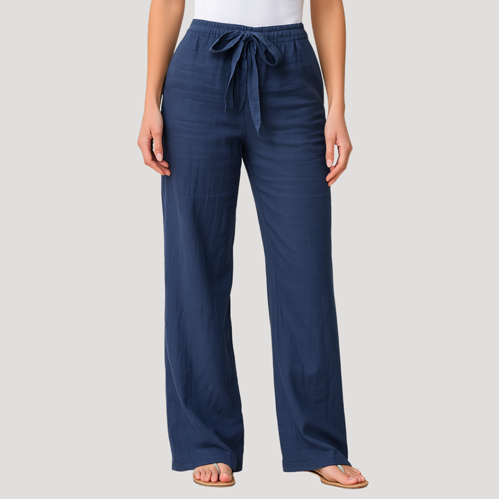 Pantalon femme en lin léger beige, taille élastique. Idéal été, fluide et respirant pour un confort décontracté.