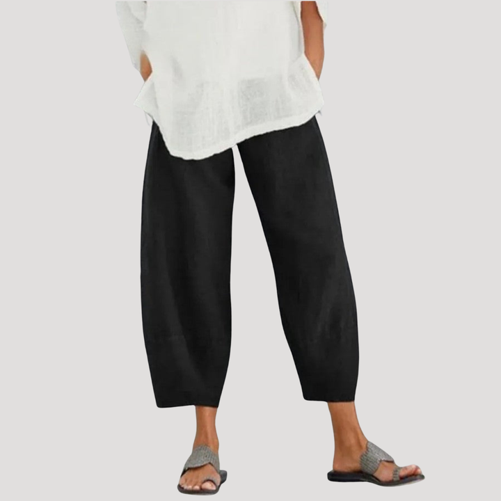 Pantalon ample décontracté en lin pour femme, couleur sable, offrant confort et élégance fluide pour l'été.