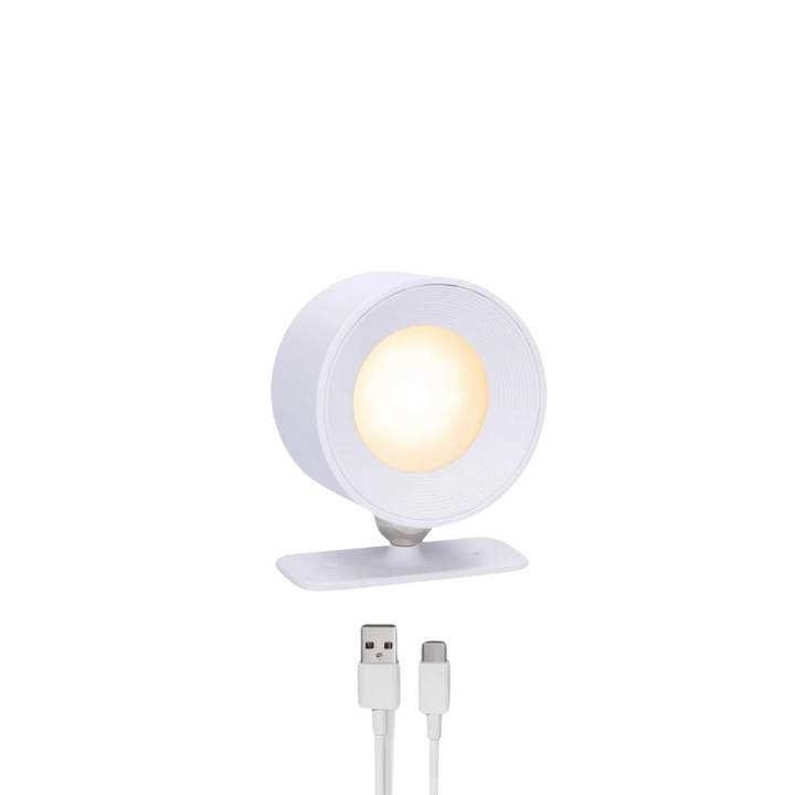Lampe LED moderne, sans fil, rechargeable, crée une ambiance lumineuse douce.