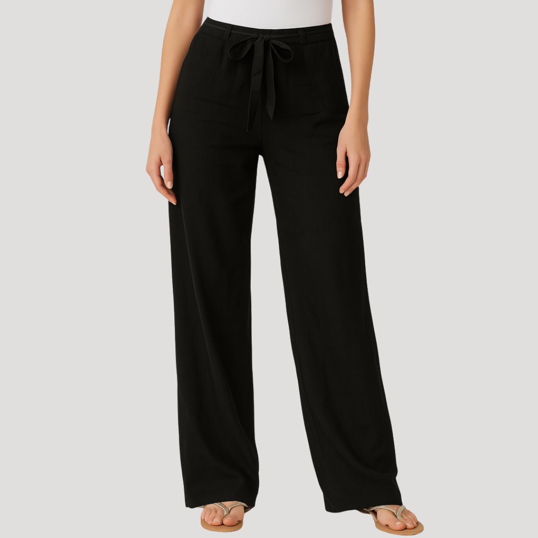 Femme portant un pantalon en lin beige léger à taille élastique. Vêtement d'été décontracté, fluide et confortable.