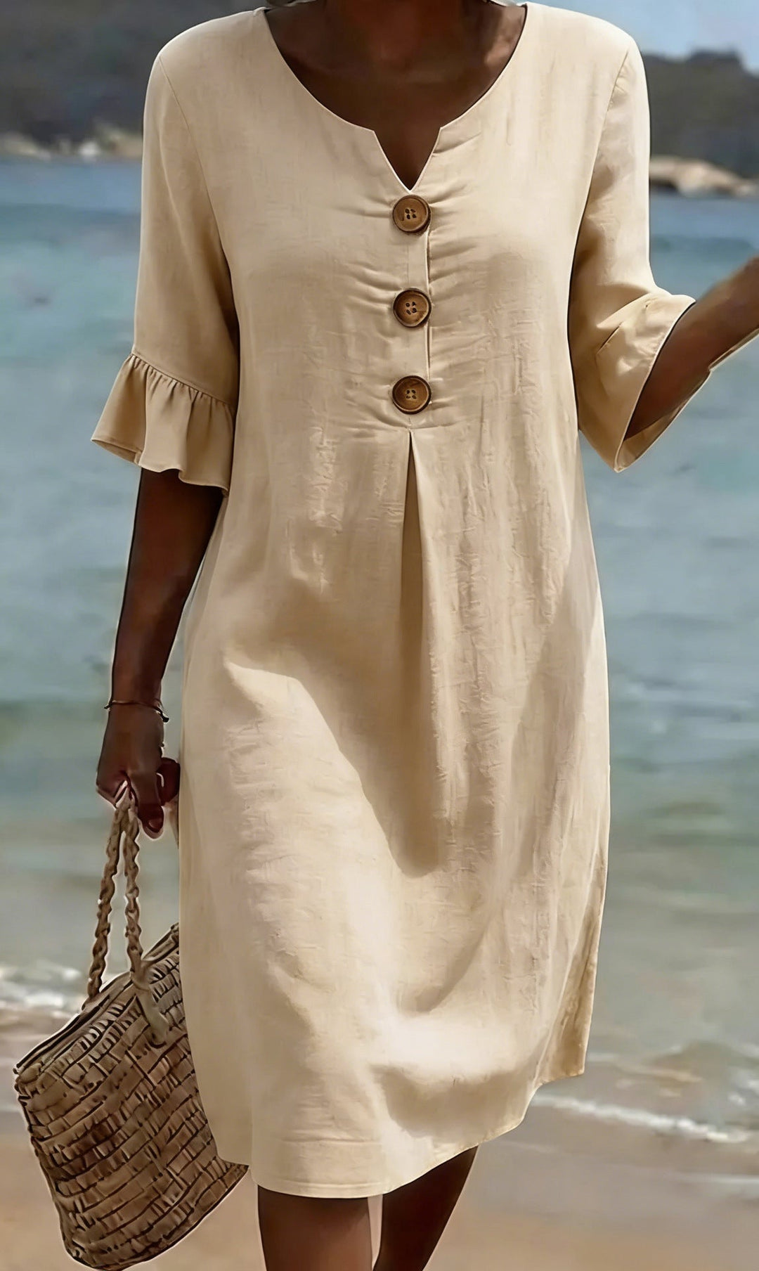 Robe femme polyvalente en coton lin, boutonnée, manches volantées. Parfaite pour ville, plage ou vacances.