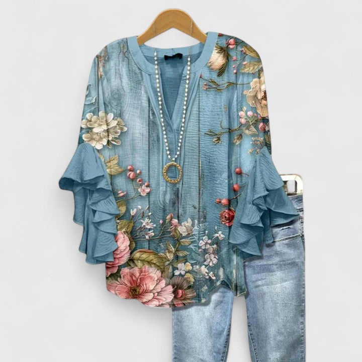 Blouse florale élégante femme, avec volants, confortable, pour un look chic au quotidien.