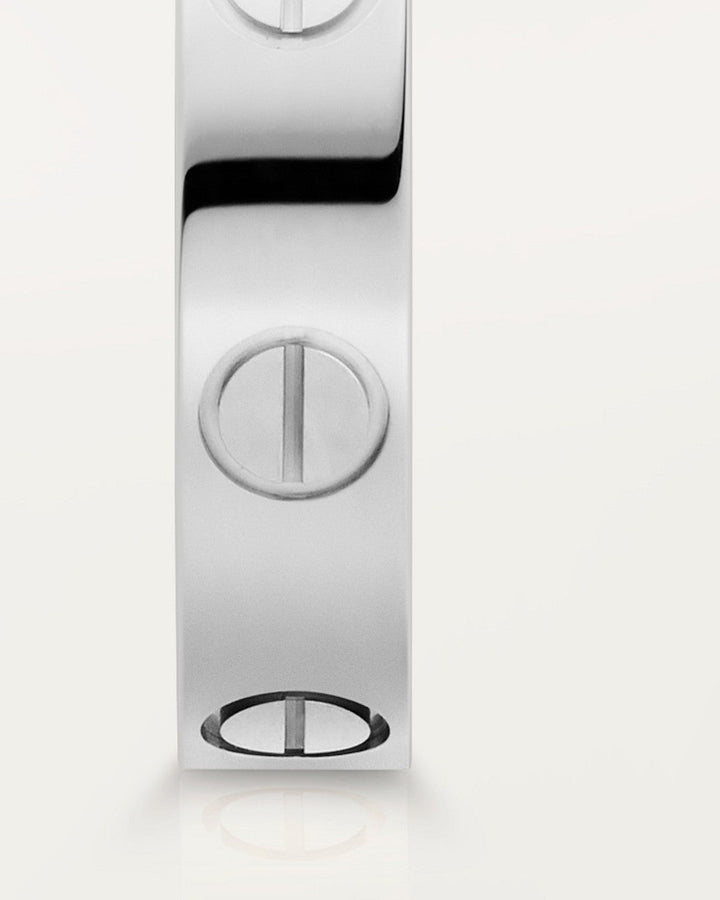 Bague Aria unisexe en argent et alliage zinc. Bijou résistant à l'eau, design moderne avec vis.