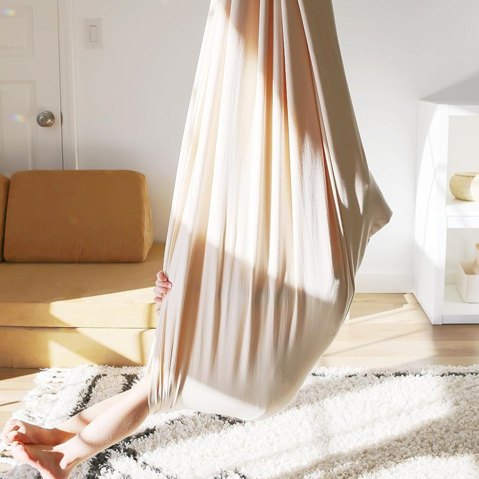 Balançoire sensorielle thérapeutique pour enfants, aidant au calme, à la concentration et aux sens.