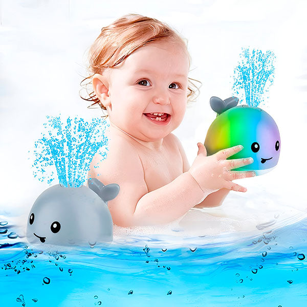 "Baleine de bain enfant LED interactive avec jets d'eau, effets lumineux multicolores et design ludique pour le bain."
