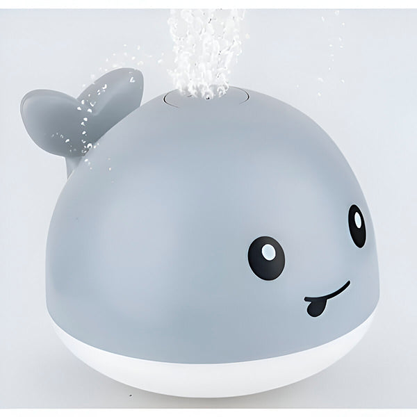 "Baleine de bain enfant LED interactive avec jets d'eau, effets lumineux multicolores et design ludique pour le bain."