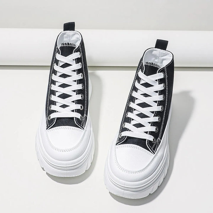 Vue détaillée des baskets blanches pour femmes avec lacets, semelle épaisse confortable et design mode printemps-été.