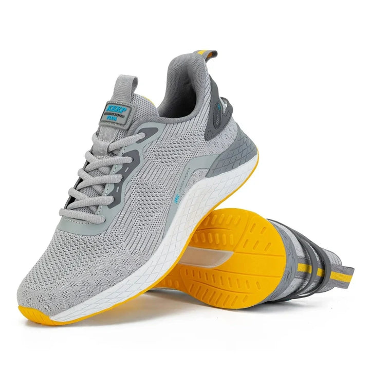 Paire de baskets homme respirantes et légères, parfaites pour le sport et le quotidien.