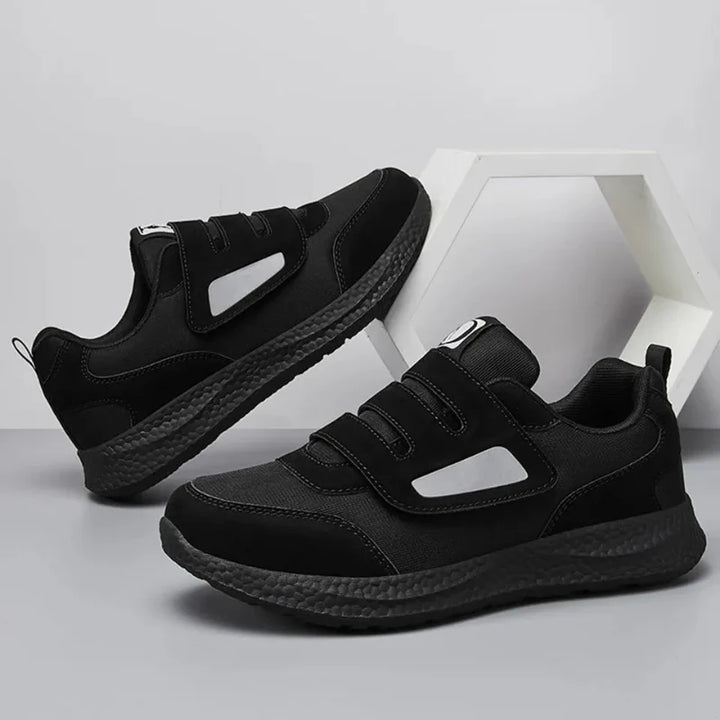 Semelle antidérapante de baskets de marche orthopédiques larges, assurant stabilité et confort pour hommes et femmes.