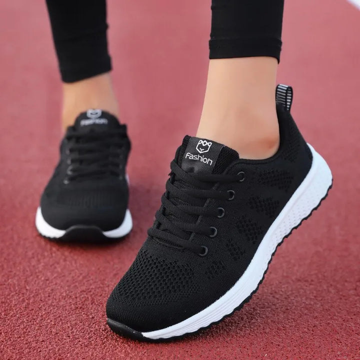 Paire de baskets de sport unisexes décontractées, légères et confortables, idéales pour le running et l'usage quotidien.
