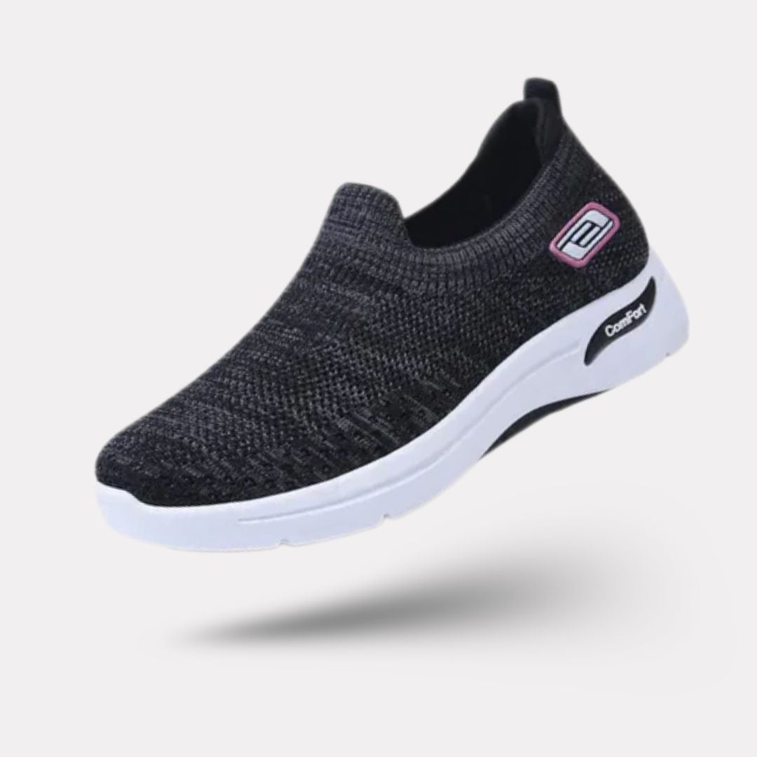 "Baskets orthopédiques pour femme en gris foncé, style moderne et semelles confortables, vue latérale élégante."