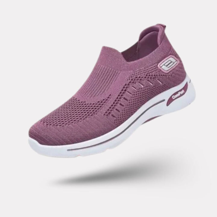 "Baskets orthopédiques pour femme en gris foncé, style moderne et semelles confortables, vue latérale élégante."
