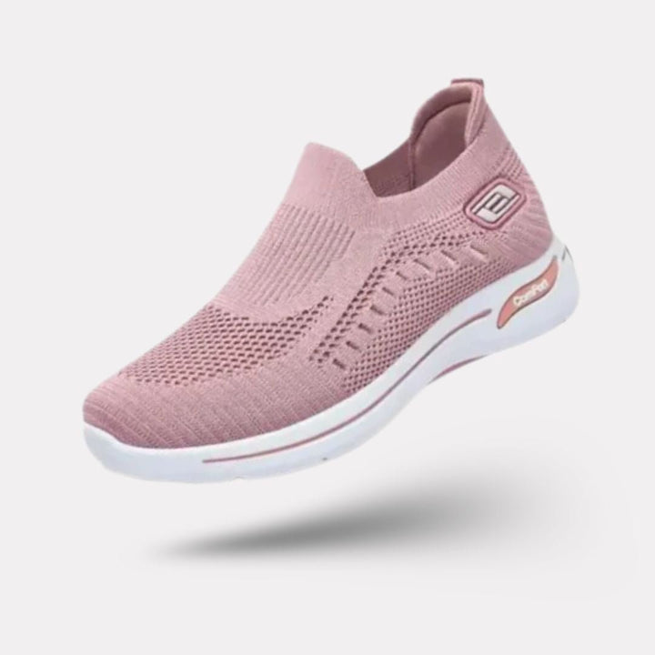 "Baskets orthopédiques pour femme en gris foncé, style moderne et semelles confortables, vue latérale élégante."