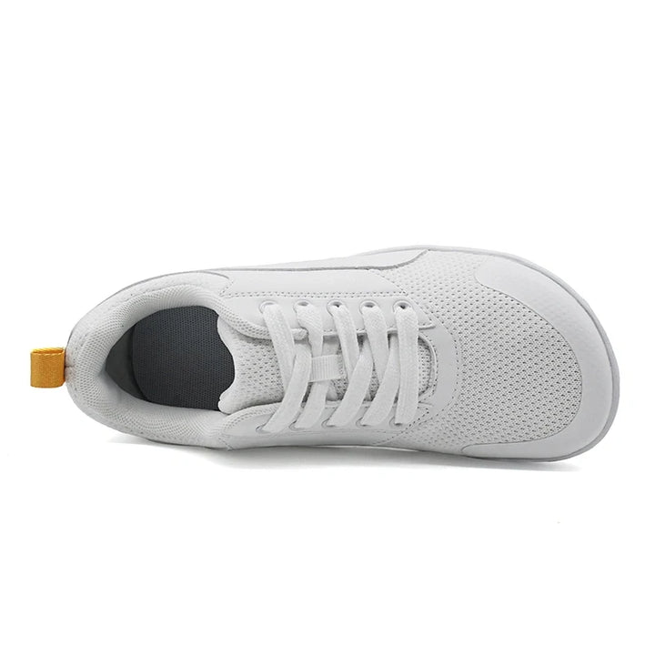 Baskets respirantes et souples avec design zero drop pour un confort optimal et une posture naturelle.