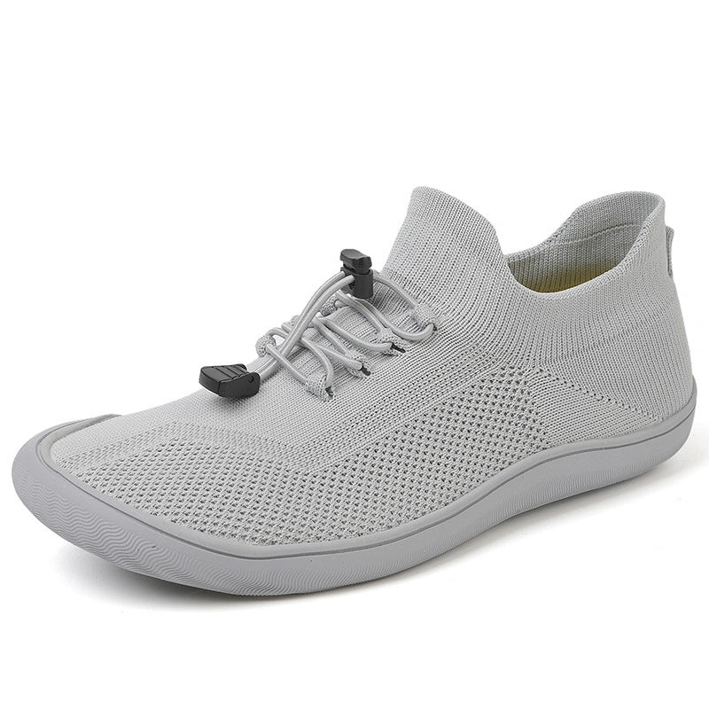 Chaussures de gym respirantes et légères, style pieds nus, idéales pour des entraînements dynamiques.