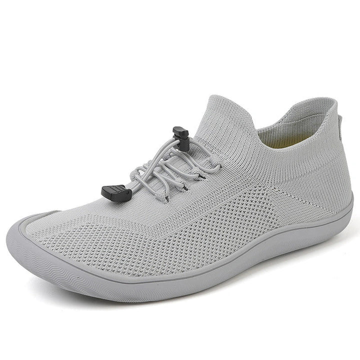 Chaussures de gym respirantes et légères, style pieds nus, idéales pour des entraînements dynamiques.