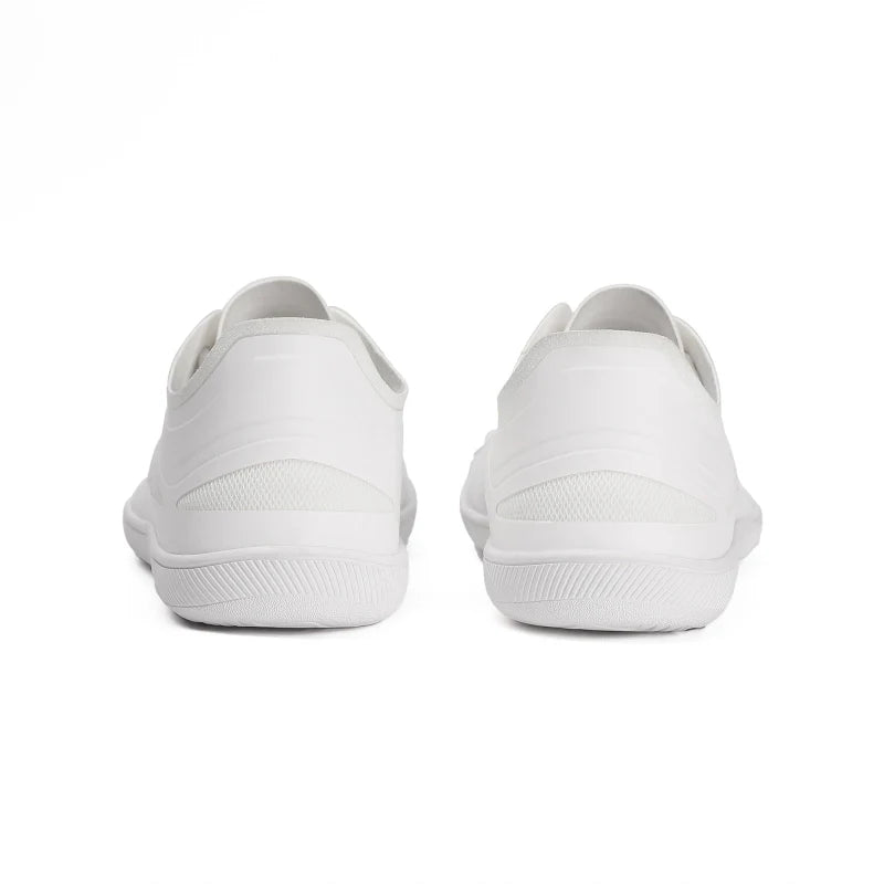 Baskets pieds nus unisexes élégantes, confort maximal et design épuré pour un look minimaliste.