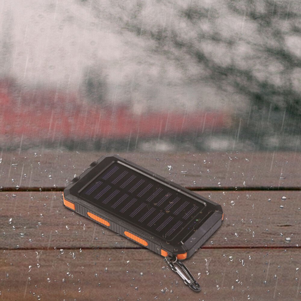 Batterie externe solaire 10 000 mAh étanche antichoc avec panneau solaire, design compact, idéale pour l'extérieur.
