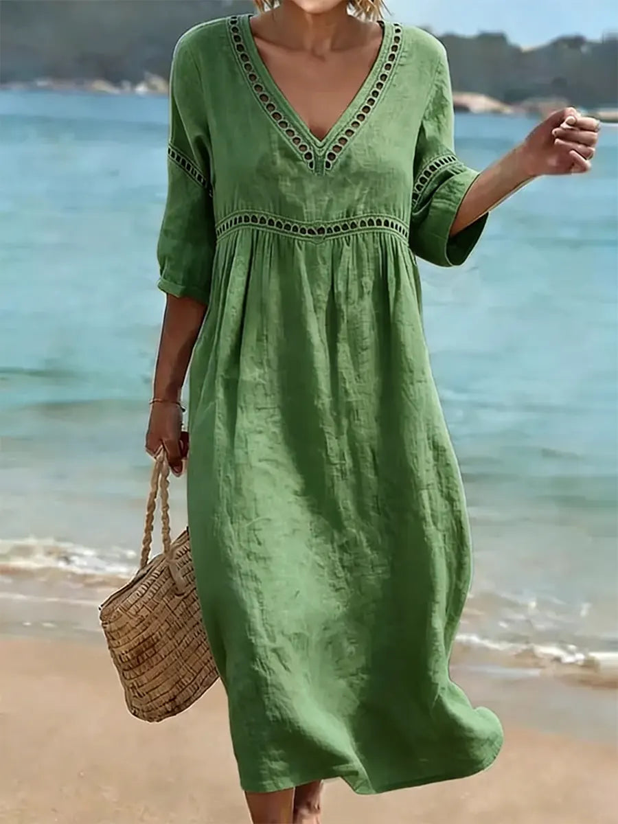 Robe femme en coton fluide avec col V, idéale pour un style décontracté chic estival. Confortable et élégante.