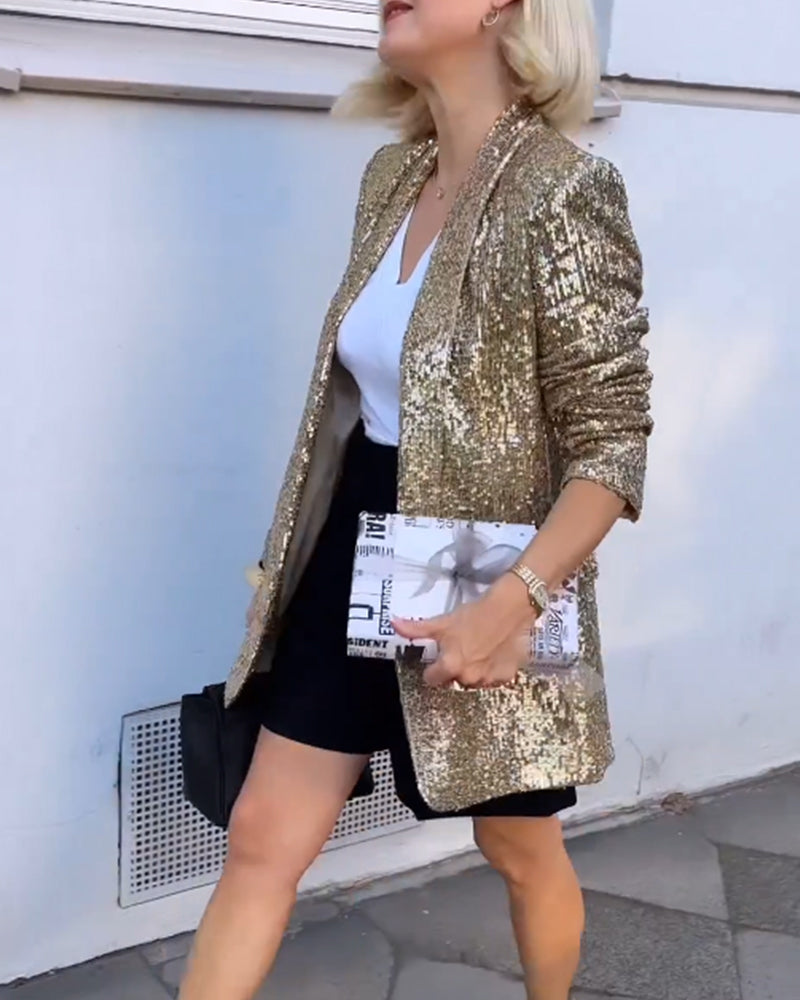 Blazer femme élégant avec des paillettes dorées scintillantes, idéal pour occasions spéciales.