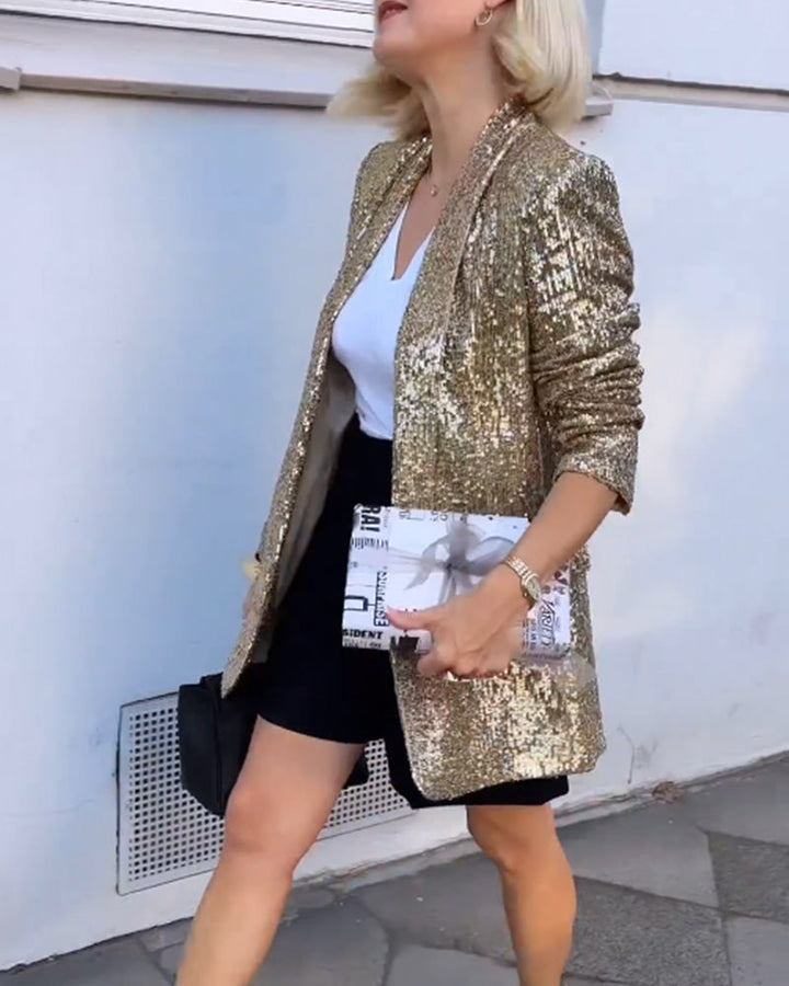Blazer femme élégant avec des paillettes dorées scintillantes, idéal pour occasions spéciales.