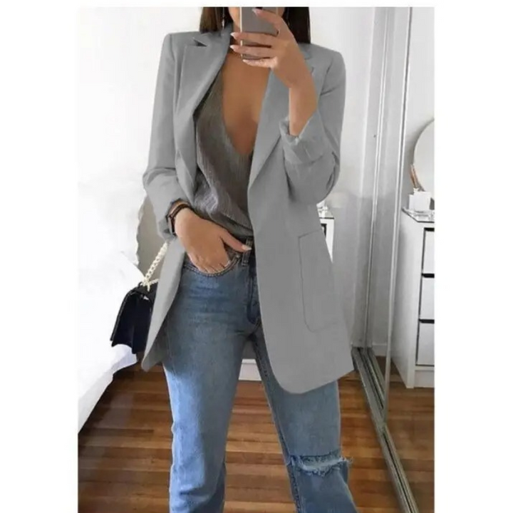 Blazer long femme élégant, coupe raffinée.  Idéal pour toutes occasions.