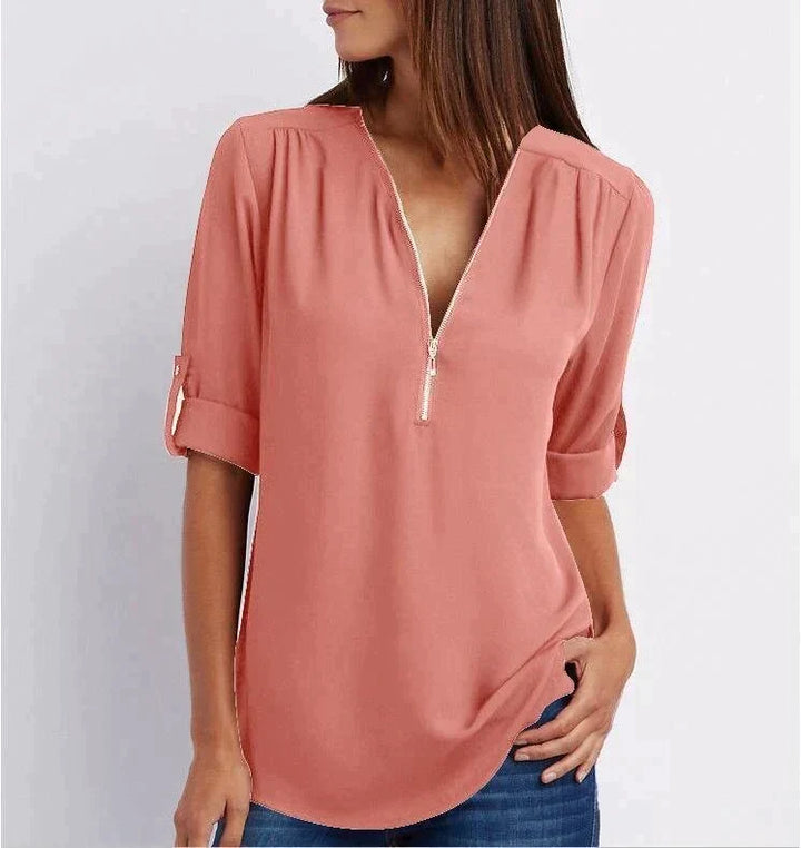 Blouse femme grande taille, ample, manches 3/4 zippées. Misez sur le confort et le style décontracté.