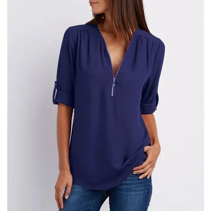 Blouse femme grande taille avec fermeture éclair décorative, ample, manches 3/4. Élégance décontractée.