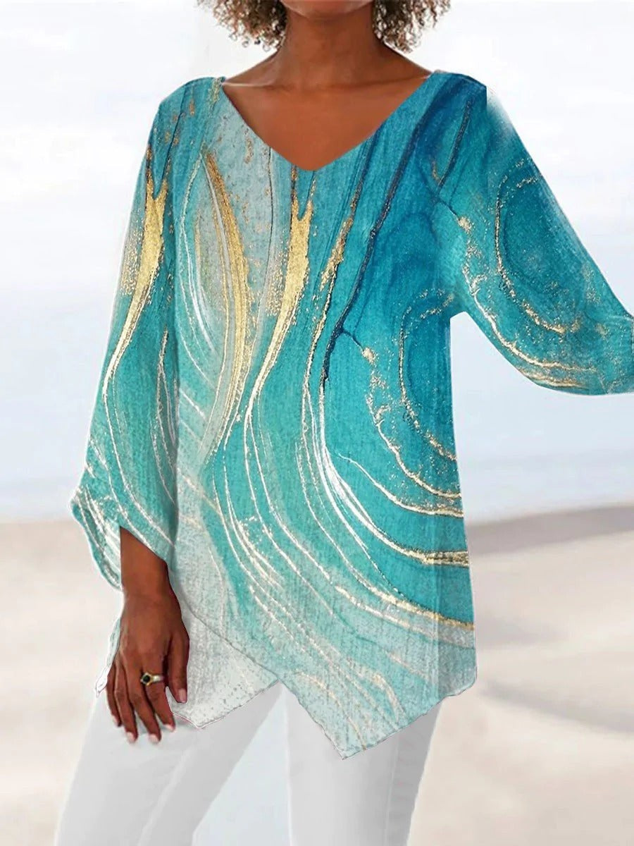 Blouse femme à col V, manches longues, motif coloré, design décontracté idéal pour un look dynamique et quotidien.