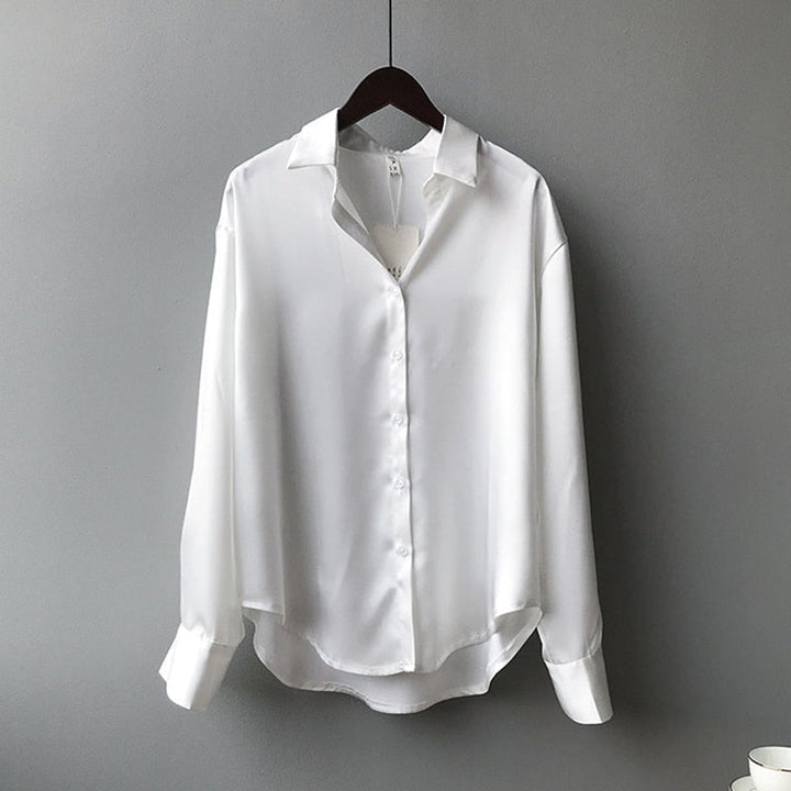 Blouse femme coupe droite, manches retroussables.  Tissu léger, style élégant et décontracté.  Parfait pour le bureau ou les 