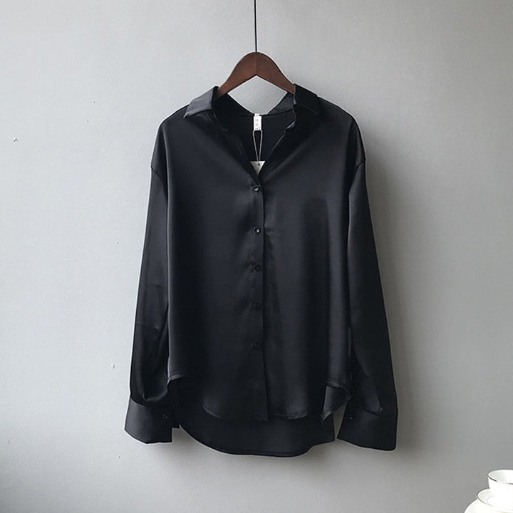 Blouse femme coupe droite, manches retroussables.  Tissu léger, style élégant et décontracté.  Parfait pour le bureau ou les 