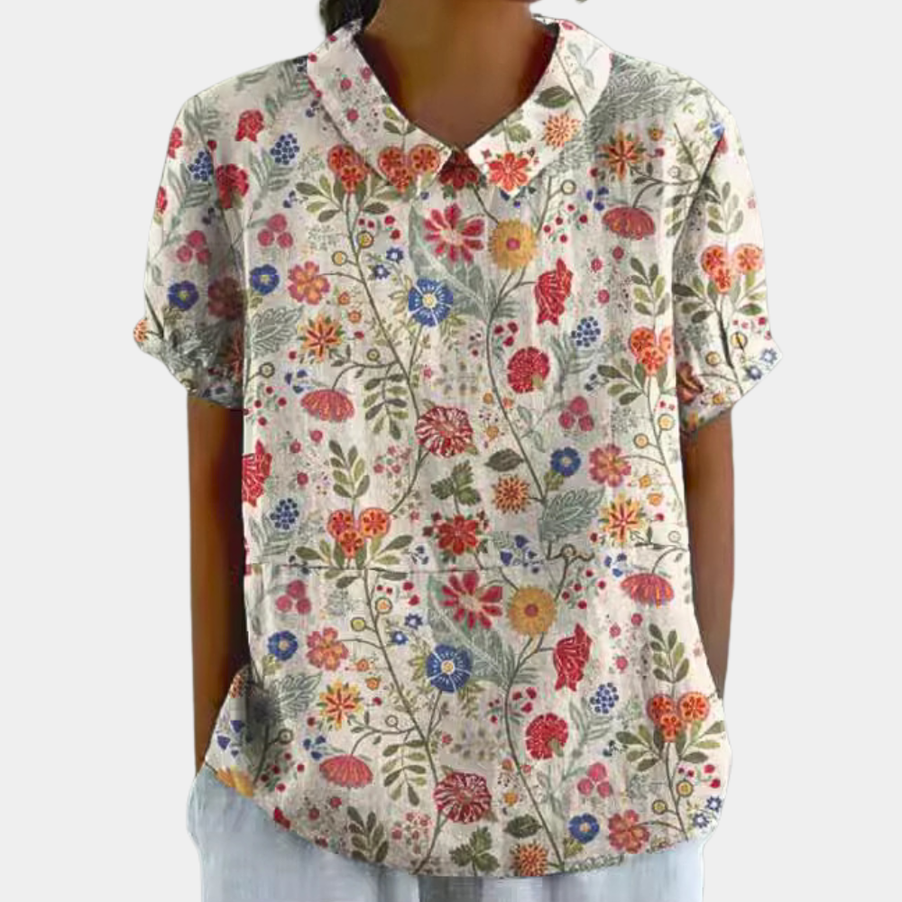 "Blouse femme manches courtes imprimé fleuri pastel, col rond, couleur abricot, chic et confortable pour un style décontracté