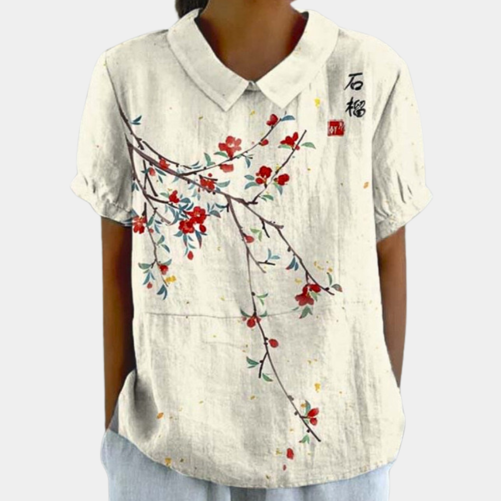 "Blouse femme manches courtes imprimé fleuri pastel, col rond, couleur abricot, chic et confortable pour un style décontracté