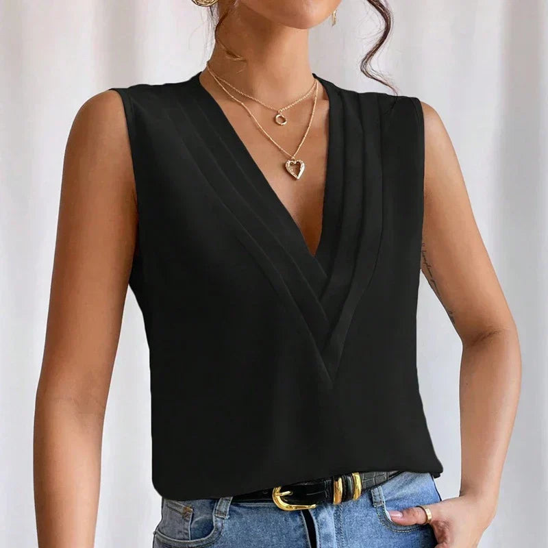 Blouse femme sans manches élégante. Polyvalente pour bureau et soirée. Confort et style.