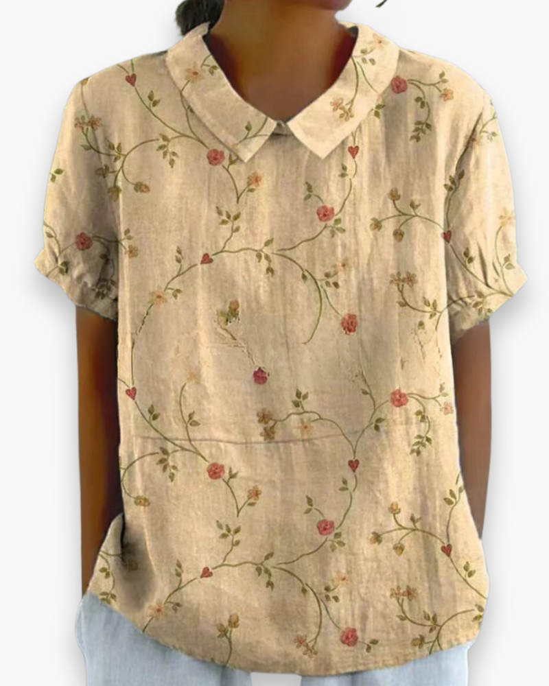 "Blouse florale décontractée pour femme, légère, motifs floraux délicats, tissu aéré, coupe confort, style printanier."