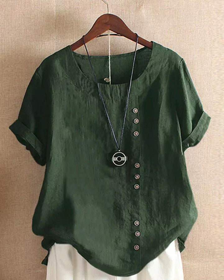 Chemisier femme élégant à manches longues, boutonnage discret, parfait pour un look chic et fluide.