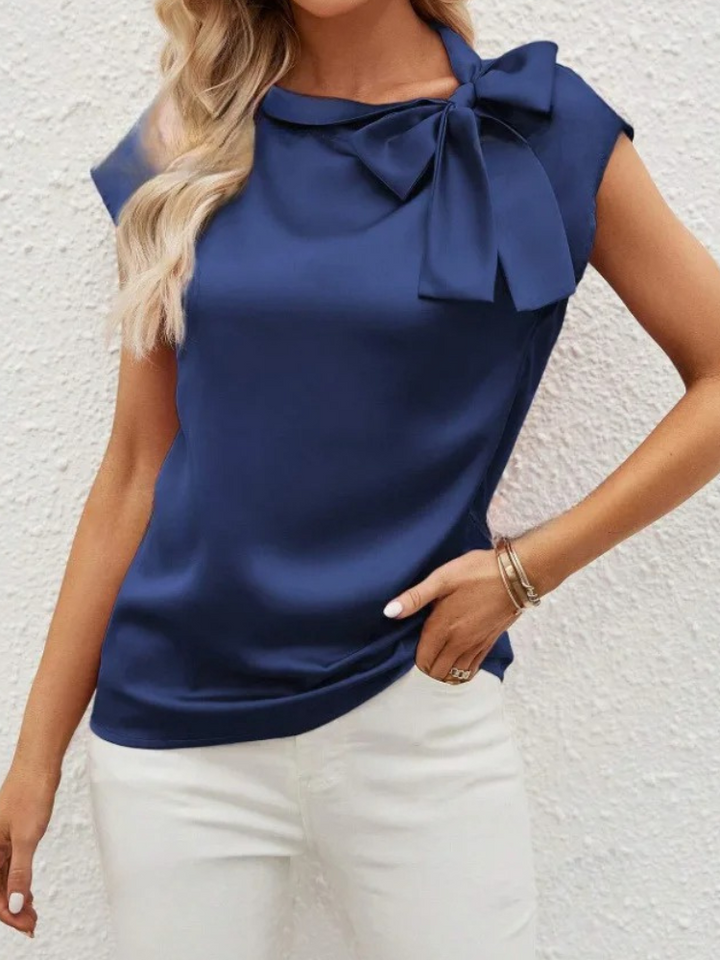 Blouse fluide élégante pour femme avec nœud, idéale pour le bureau ou une soirée chic.