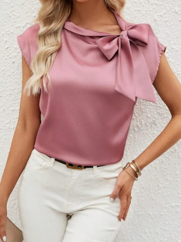 Blouse colorée fluide pour femme, ornée d'un nœud, ajoutant une touche distinctive à votre tenue.