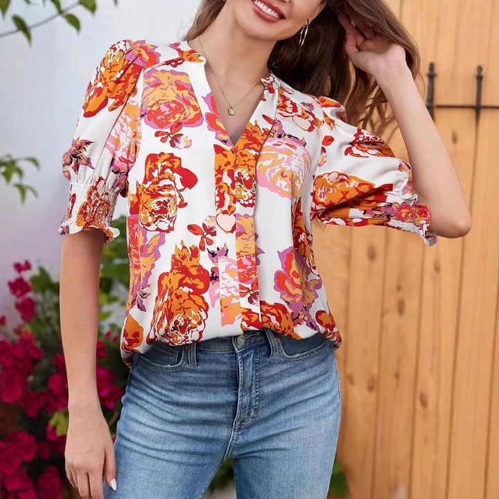 Blouse fluide longue pour femme, élégante et confortable, idéale pour un style chic parisien au printemps.