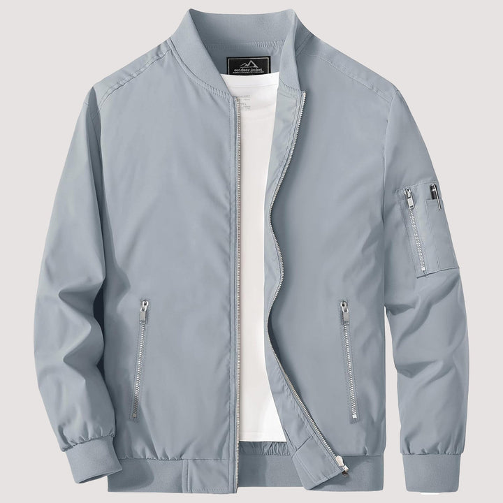 "Blouson bomber léger homme printemps, coupe moderne, fermeture éclair visible, idéal pour brises printanières."