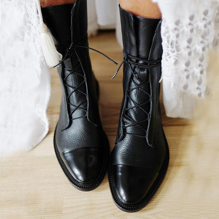 Bottes classiques en cuir marron pour femmes, élégantes et confortables, idéales pour un style intemporel et sophistiqué.