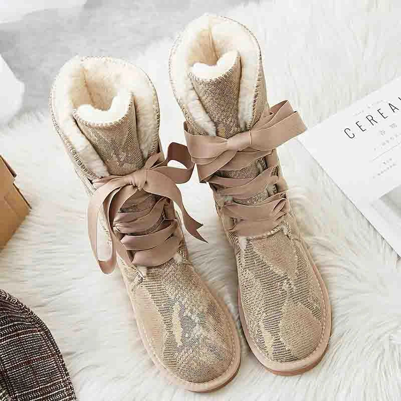 Bottes hiver femme élégantes, doublées pour chaleur maximale, avec lacets, parfaites pour le confort hivernal.