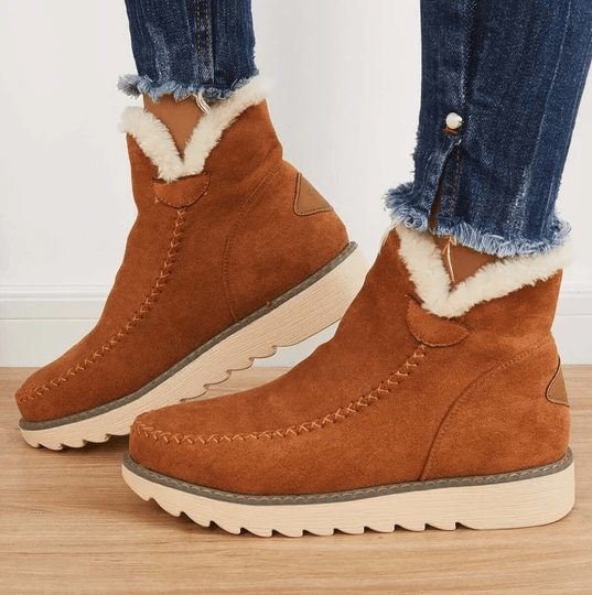 Bottes femme hiver avec doublure douce, confortables et chaudes, idéales pour affronter le froid et la neige.