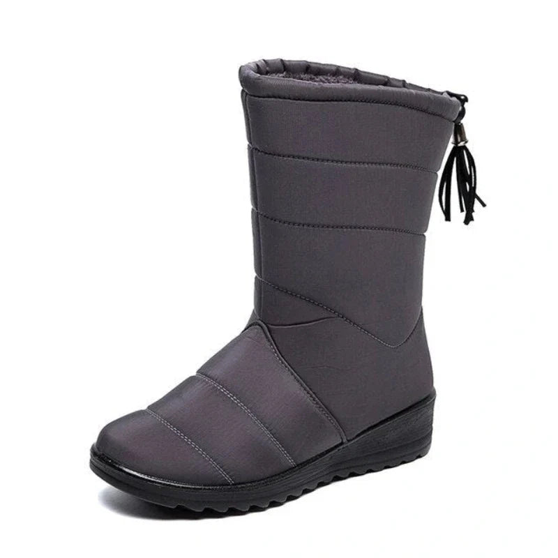 Bottes d'hiver hautes pour femmes, imperméables et fourrées, idéales pour la neige.