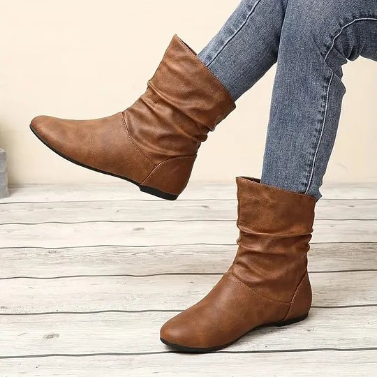 Bottes femme élégantes noires avec semelle antidérapante, idéales pour un confort chic et sécurisé.