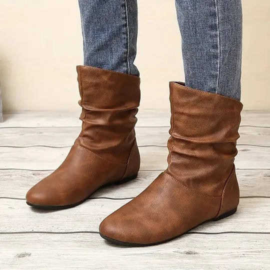 Bottes femme confortables et mi-hautes, style chic, offrant un maintien optimal et une marche stable.